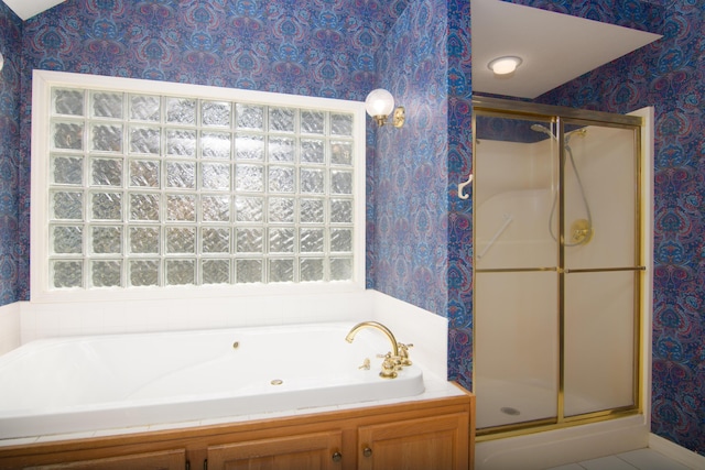 618 Parnell Cir, Branson, MO 65616 - bathroom featuring wallpapered walls, a stall shower, a garden tub, and plenty of natural light