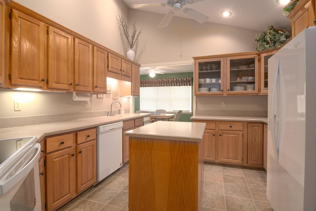 618 Parnell Cir, Branson, MO 65616 - kitchen with white appliances, a ceiling fan, light countertops, a kitchen island, and vaulted ceiling