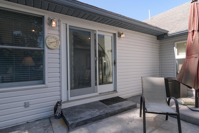 618 Parnell Cir, Branson, MO 65616 - doorway to property with a patio area and roof with shingles