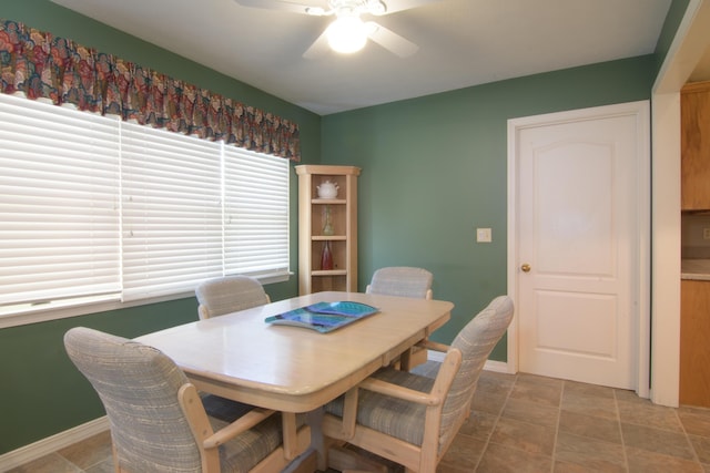 618 Parnell Cir, Branson, MO 65616 - dining room featuring a ceiling fan and stone finish flooring