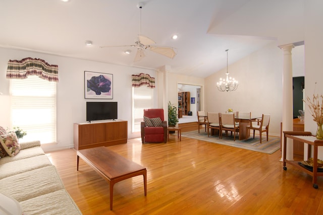 618 Parnell Cir, Branson, MO 65616 - living area with vaulted ceiling, light wood-style floors, a ceiling fan, a chandelier, and decorative columns