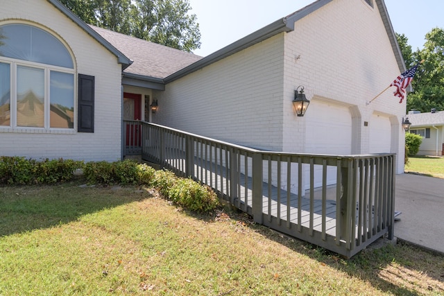 618 Parnell Cir, Branson, MO 65616 - view of property exterior with brick siding, an attached garage, and a lawn
