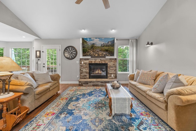 277 Country Bluff Dr, Branson, MO 65616 - living room with lofted ceiling, wood finished floors, a ceiling fan, plenty of natural light, and a fireplace
