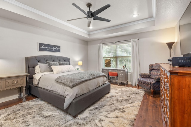 277 Country Bluff Dr, Branson, MO 65616 - bedroom featuring wood finished floors, a tray ceiling, ornamental molding, ceiling fan, and recessed lighting