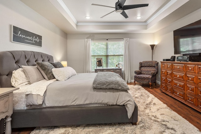 277 Country Bluff Dr, Branson, MO 65616 - bedroom featuring ornamental molding, a tray ceiling, dark wood-style floors, and a ceiling fan