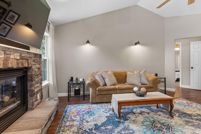 277 Country Bluff Dr, Branson, MO 65616 - living room with ceiling fan, vaulted ceiling, wood finished floors, and a glass covered fireplace