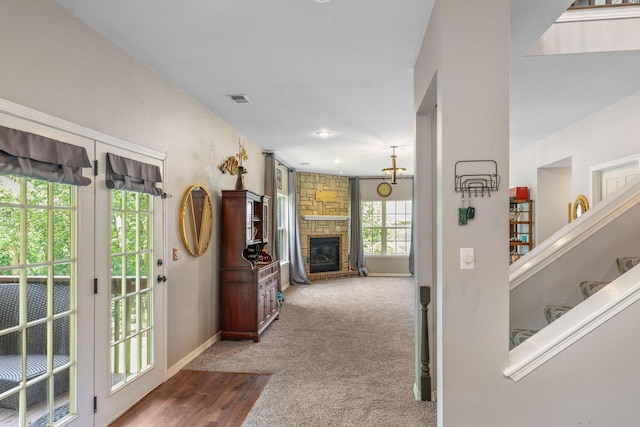 277 Country Bluff Dr, Branson, MO 65616 - carpeted entrance foyer featuring a stone fireplace and baseboards