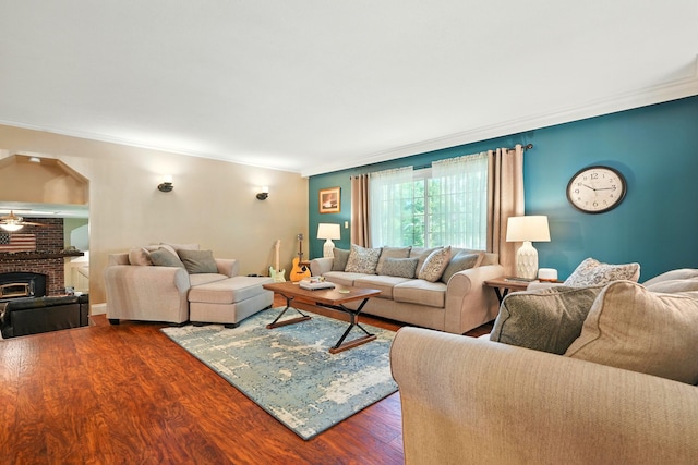 107 Oakwood Dr, Branson, MO 65616 - living room with crown molding, dark wood finished floors, and a brick fireplace
