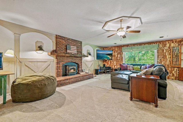 107 Oakwood Dr, Branson, MO 65616 - carpeted living room with a wood stove and ceiling fan