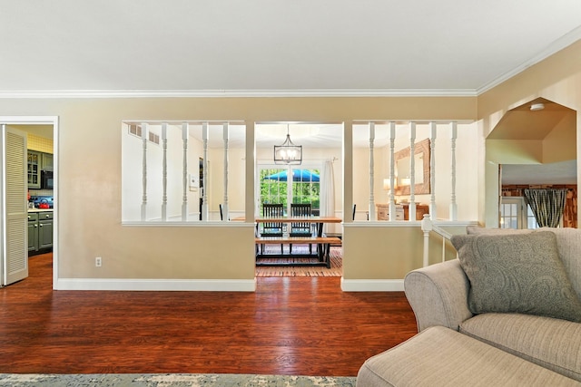 107 Oakwood Dr, Branson, MO 65616 - living area featuring ornamental molding, wood finished floors, and a chandelier