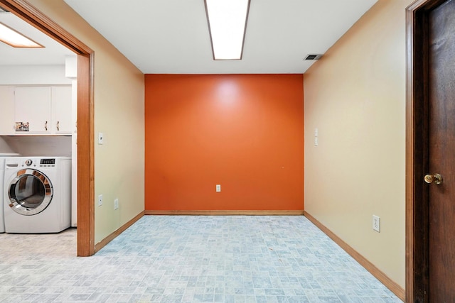 107 Oakwood Dr, Branson, MO 65616 - washroom with washer / dryer and cabinet space
