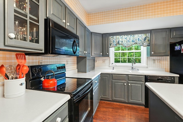 107 Oakwood Dr, Branson, MO 65616 - kitchen featuring black appliances, gray cabinetry, glass insert cabinets, and light countertops