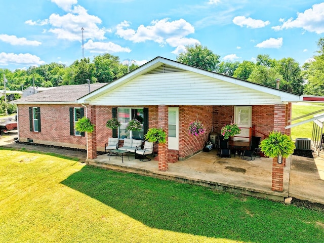 18189 2nd St, Eminence, MO 65466 - back of property featuring a lawn, a patio, and brick siding
