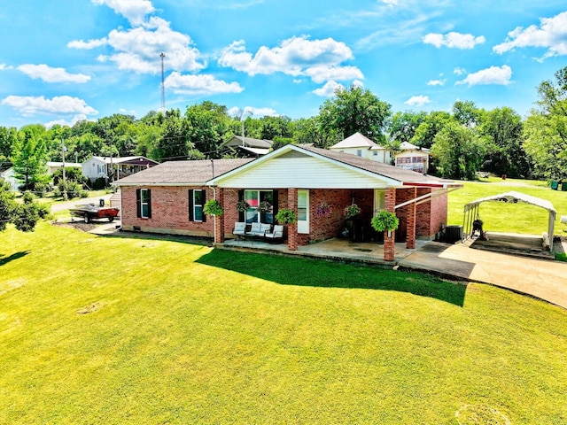 18189 2nd St, Eminence, MO 65466 - ranch-style home with a front lawn, brick siding, covered porch, and driveway