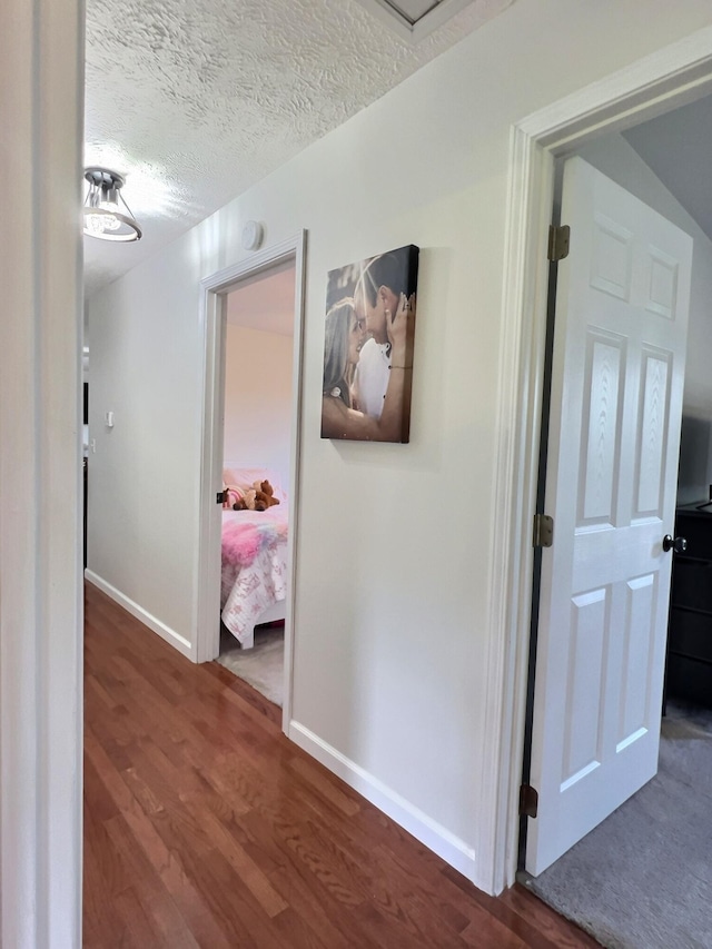 18189 2nd St, Eminence, MO 65466 - corridor featuring wood finished floors and a textured ceiling