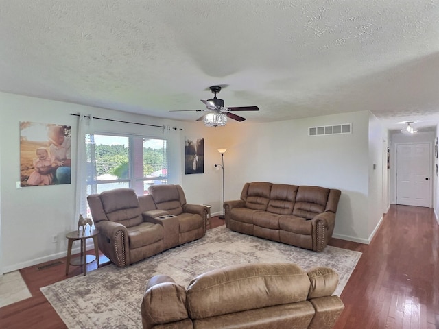 18189 2nd St, Eminence, MO 65466 - living area featuring a textured ceiling, a ceiling fan, and wood finished floors