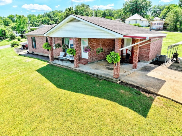 18189 2nd St, Eminence, MO 65466 - rear view of house featuring brick siding, a yard, and a shingled roof
