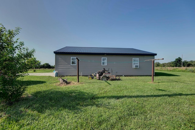 361 Durington Rd, Buffalo, MO 65622 - rear view of house featuring a yard and a metal roof