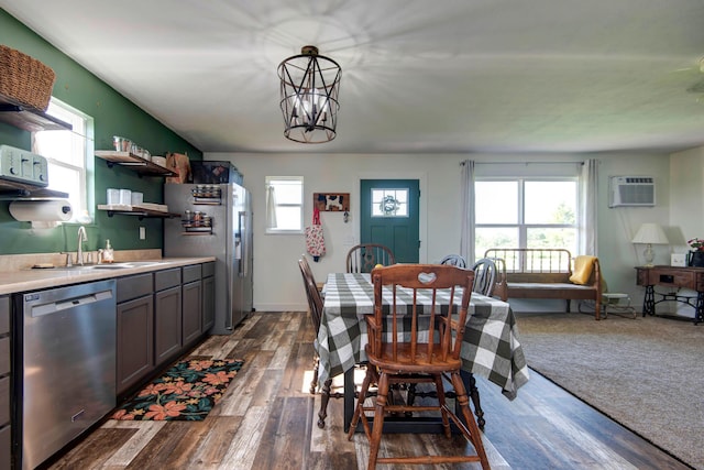 361 Durington Rd, Buffalo, MO 65622 - dining area featuring a chandelier, a wall unit AC, and dark wood finished floors