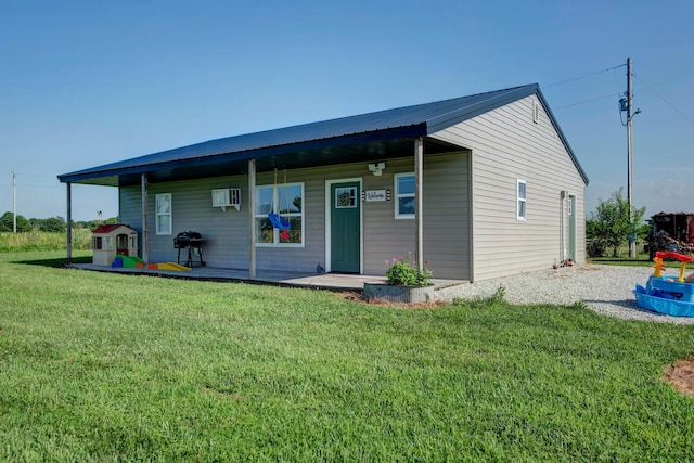 361 Durington Rd, Buffalo, MO 65622 - view of front of home featuring a porch, a front yard, and a wall mounted air conditioner