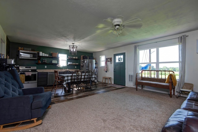361 Durington Rd, Buffalo, MO 65622 - carpeted living room with a ceiling fan and a chandelier