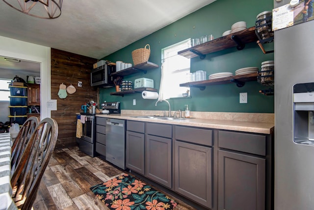 361 Durington Rd, Buffalo, MO 65622 - kitchen featuring stainless steel appliances, open shelves, gray cabinets, dark wood-style floors, and wooden walls