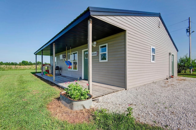 361 Durington Rd, Buffalo, MO 65622 - view of side of home featuring covered porch and a yard