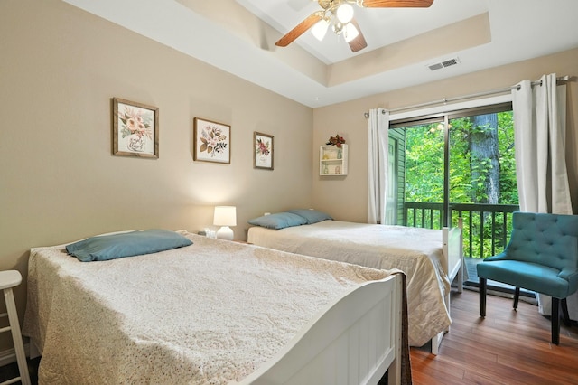 7815 Cozy Cove Rd Unit 3-15, Branson, MO 65616 - bedroom with a tray ceiling, dark wood-style flooring, and ceiling fan