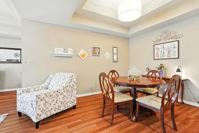7815 Cozy Cove Rd Unit 3-15, Branson, MO 65616 - dining area featuring light wood finished floors and a raised ceiling