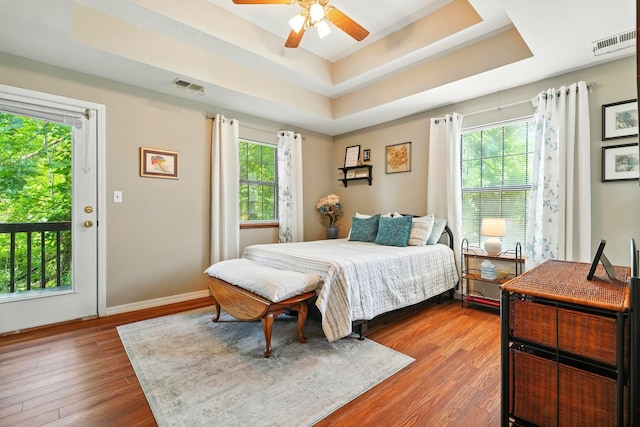 7815 Cozy Cove Rd Unit 3-15, Branson, MO 65616 - bedroom with a tray ceiling, wood finished floors, and a ceiling fan