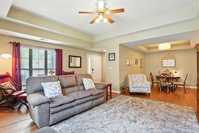 7815 Cozy Cove Rd Unit 3-15, Branson, MO 65616 - living area featuring a raised ceiling, wood finished floors, and ceiling fan