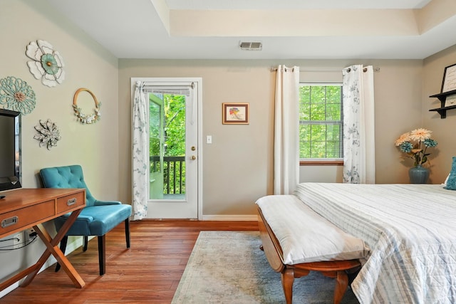 7815 Cozy Cove Rd Unit 3-15, Branson, MO 65616 - bedroom with access to exterior, wood finished floors, and multiple windows