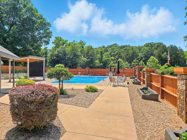 7815 Cozy Cove Rd Unit 3-15, Branson, MO 65616 - view of swimming pool featuring a patio area and a fenced backyard