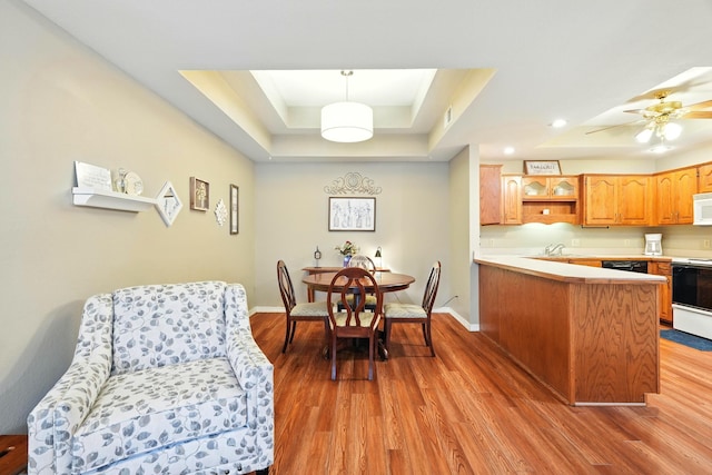 7815 Cozy Cove Rd Unit 3-15, Branson, MO 65616 - dining area featuring a raised ceiling, light wood-style flooring, and recessed lighting