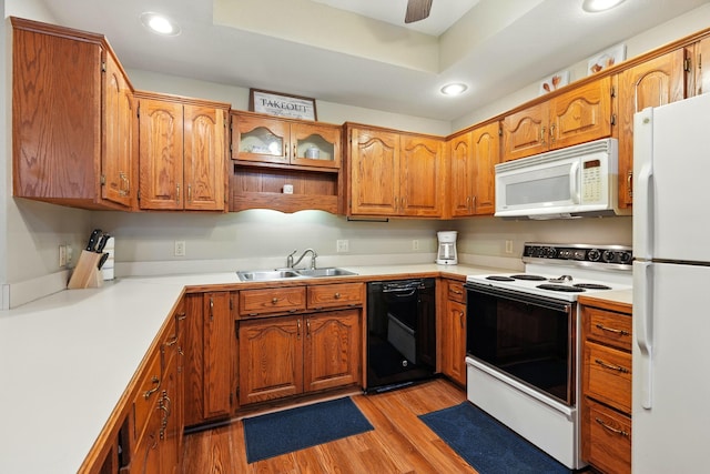 7815 Cozy Cove Rd Unit 3-15, Branson, MO 65616 - kitchen featuring white appliances, light wood-style floors, brown cabinets, recessed lighting, and light countertops