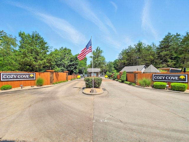 7815 Cozy Cove Rd Unit 3-15, Branson, MO 65616 - view of concrete road featuring a gated entry and curbs