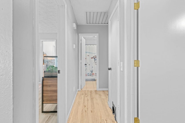 208 S Poplar Ct, Nixa, MO 65714 - corridor featuring light wood-type flooring and baseboards