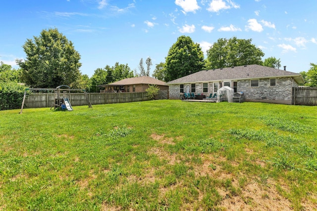 208 S Poplar Ct, Nixa, MO 65714 - fenced backyard with a playground and a patio area