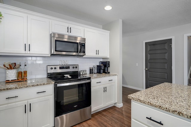 504 Gauge St, Willard, MO 65781 - kitchen with stainless steel appliances, dark wood-type flooring, backsplash, light stone countertops, and recessed lighting