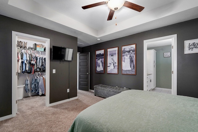 504 Gauge St, Willard, MO 65781 - bedroom with a tray ceiling, a spacious closet, light carpet, and a ceiling fan