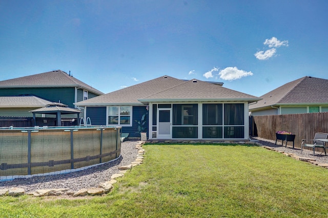 504 Gauge St, Willard, MO 65781 - rear view of house with a gazebo, a sunroom, a shingled roof, and a fenced backyard