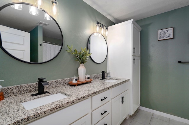 504 Gauge St, Willard, MO 65781 - bathroom with double vanity and tile patterned flooring