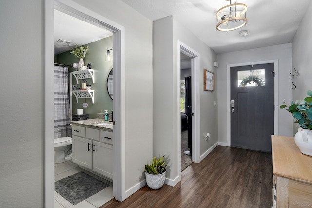 504 Gauge St, Willard, MO 65781 - entryway featuring dark wood-style floors and baseboards