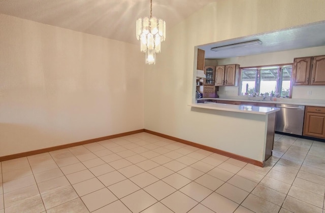 1746 Wall Rd, Mountain Grove, MO 65711 - kitchen featuring dishwasher, light countertops, light tile patterned floors, a chandelier, and a peninsula
