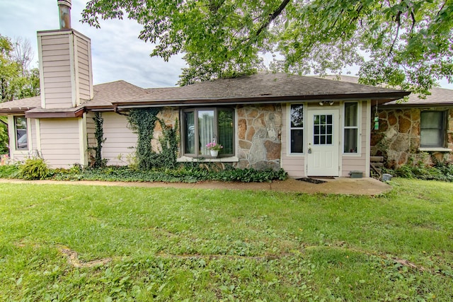 1746 Wall Rd, Mountain Grove, MO 65711 - view of front facade with a front yard, a chimney, roof with shingles, and stone siding