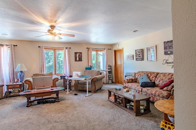 1746 Wall Rd, Mountain Grove, MO 65711 - living room featuring carpet floors, a textured ceiling, and a ceiling fan