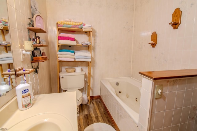 1746 Wall Rd, Mountain Grove, MO 65711 - bathroom featuring tile walls, wood finished floors, and a tub with jets