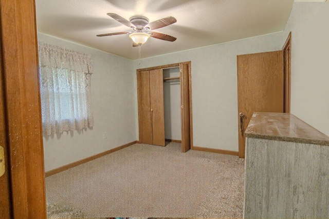 1746 Wall Rd, Mountain Grove, MO 65711 - unfurnished bedroom with carpet, a closet, and a ceiling fan