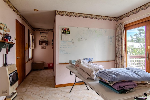 1746 Wall Rd, Mountain Grove, MO 65711 - bedroom with heating unit and light tile patterned flooring