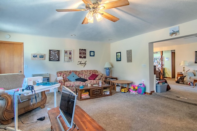 1746 Wall Rd, Mountain Grove, MO 65711 - carpeted living room featuring a ceiling fan and a textured ceiling